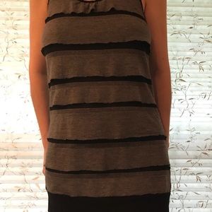A sleeveless black and grey ruffled top